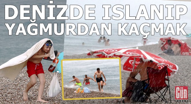 Denize girip ıslananlar yağmurda ıslanmamak için kaçıştı